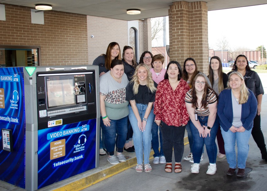 Charles City staff standing in front of an ITM.