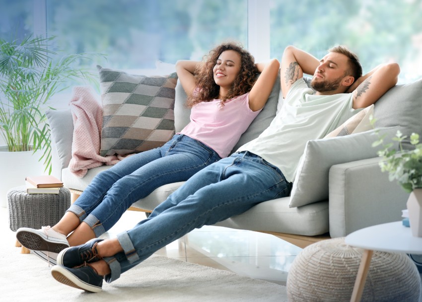 Young couple relaxing on couch.