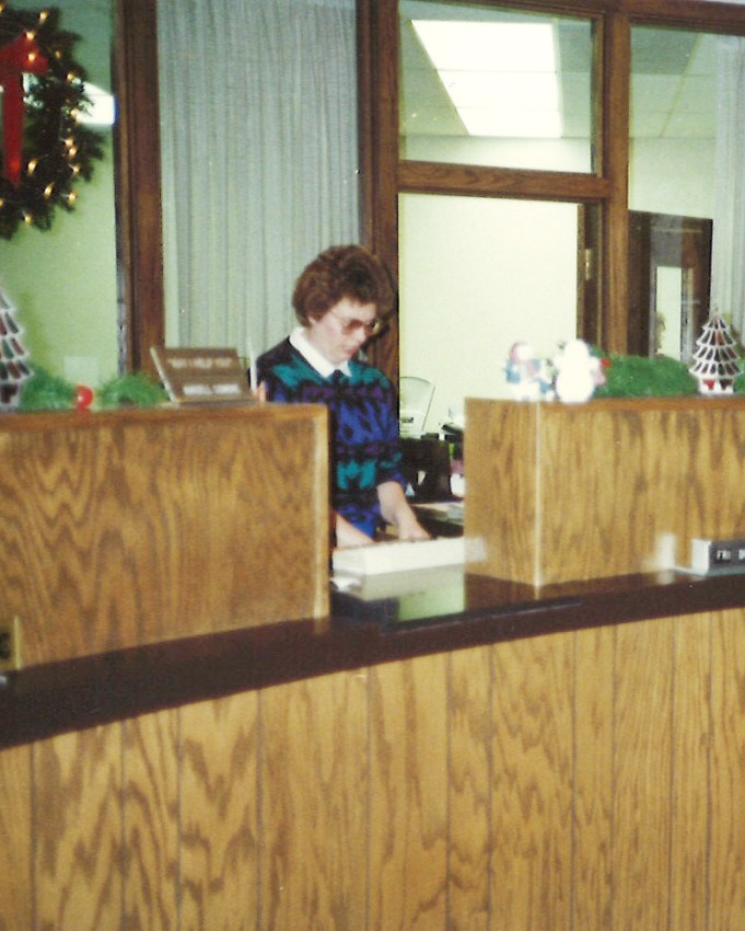 Donnis working as a Teller in 1985.