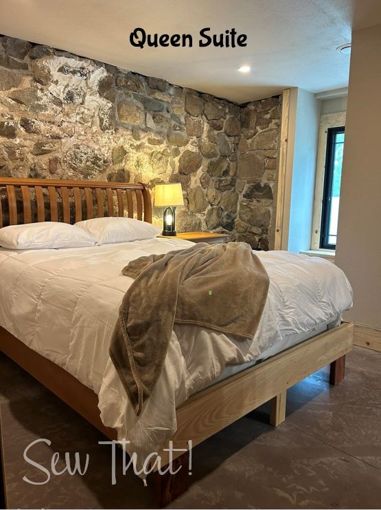 Bed against limestone wall.